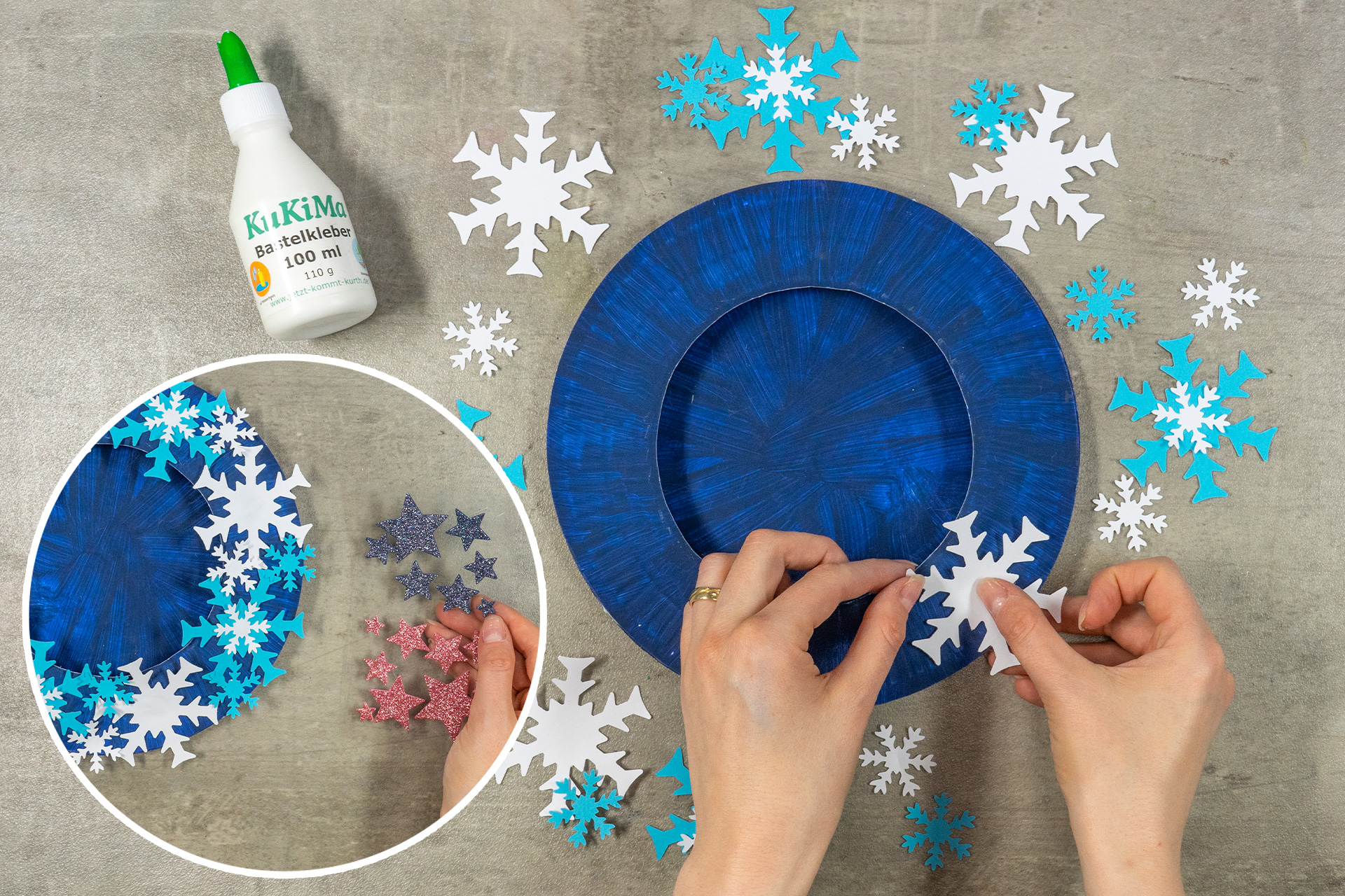 <p>Die ausgestanzten Schneeflocken klebe ich auf den Papptellerrand und verziere ihn zusätzlich mit blauen und weißen Glitzer